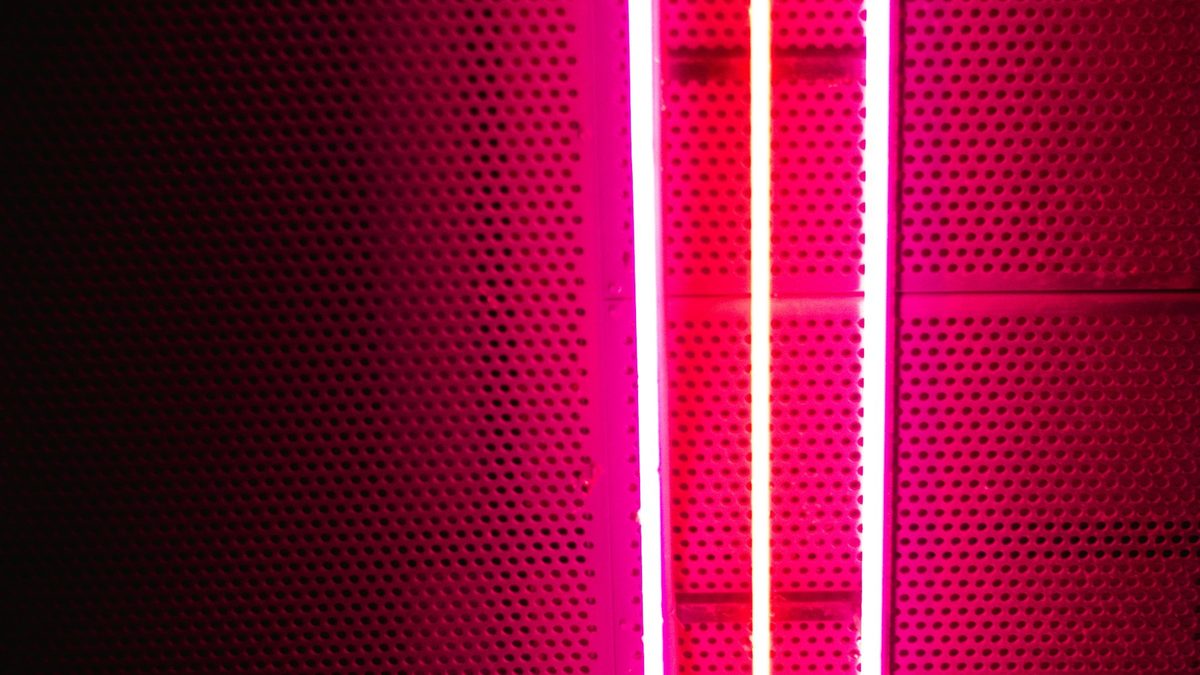 Pink neon arrow pointing down